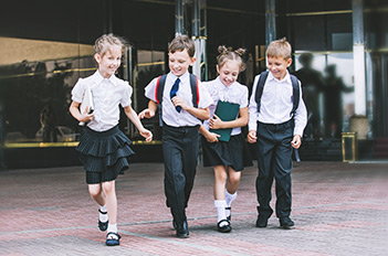 Young kids in school uniforms